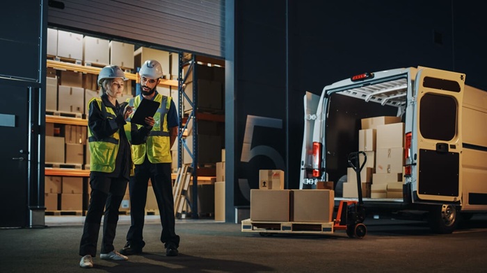 outside-logistics-distributions-warehouse-with-manager-using-tablet-computer-diverse-workers-loading